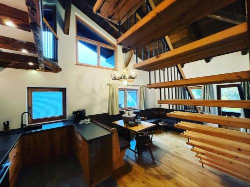 a kitchen and living room in a log cabin at Bauernhof Stempf in Heiligenblut