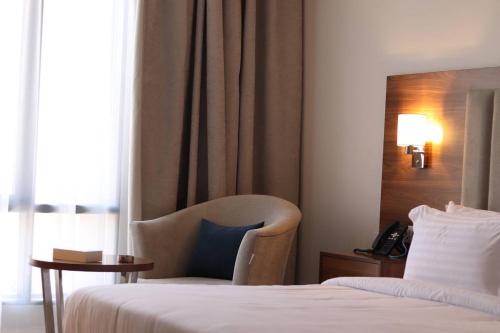 Кровать или кровати в номере شقق الشرفه للشقق الفندقيه - Shorfa Hotel Apartments