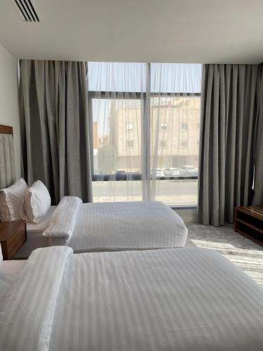 Кровать или кровати в номере شقق الشرفه للشقق الفندقيه - Shorfa Hotel Apartments