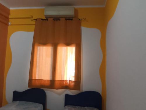 A bed or beds in a room at Casetta vacanze Gonnesa