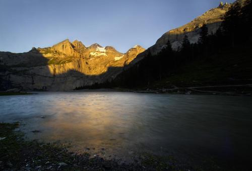 a view of a river with mountains in the background at Toni's Alpine Loft & SPA in Kandersteg