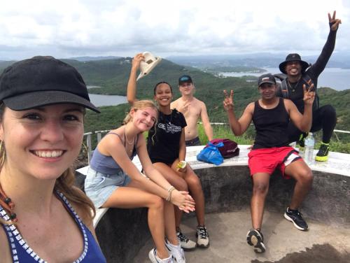 a group of people posing for a picture on a mountain at Top Hill Hostel- Martinique- auberge dortoir in La Trinité