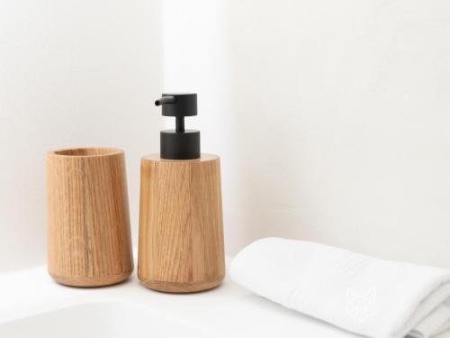 a bathroom with a faucet and a toilet paper holder at Tiny Fox Kluisbos in Mont-de-l'Enclus