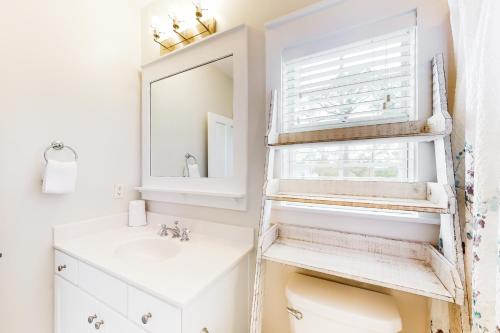 a bathroom with a ladder over the toilet at Barefoot Cottages #B8 Jasmine by the Bay in Highland View