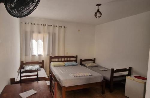 Кровать или кровати в номере Pousada Encantos da Maré