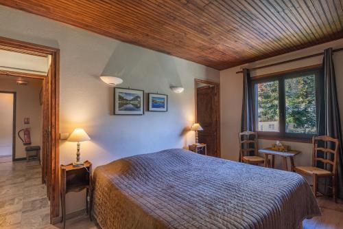 Katil atau katil-katil dalam bilik di Chambres d'hôtes les Murès du Mercantour