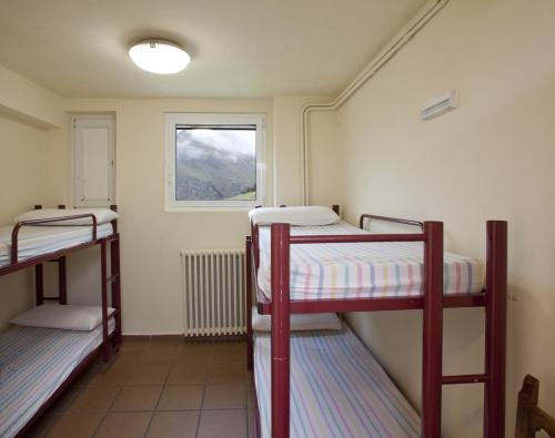 Postel nebo postele na pokoji v ubytování Alberg Núria Xanascat