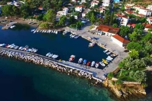 an aerial view of a marina with boats in the water at Villa EnElladi in Neos Pirgos