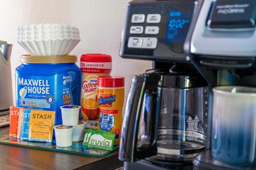 a counter top with a coffee maker and some food at The Estate at Mt Dora in Mount Dora