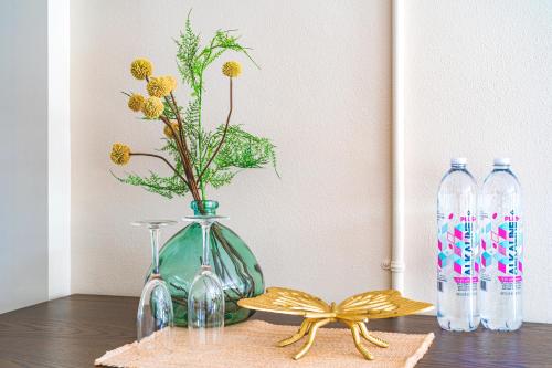 a vase with flowers in it sitting on a table at The Estate at Mt Dora in Mount Dora