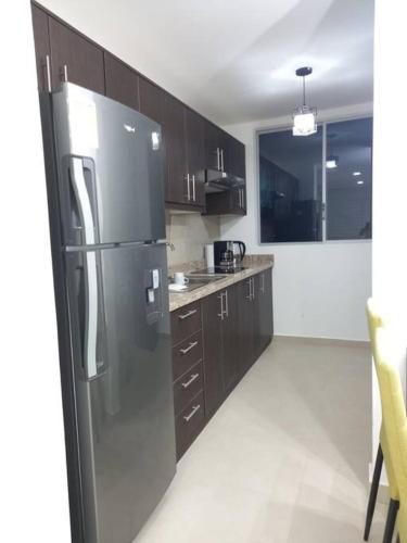Kuchyň nebo kuchyňský kout v ubytování Edif. Deymar - Departamento frente al mar 9no piso
