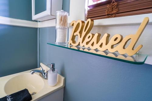a bathroom with a sink and a sign that reads renewal at The Estate at Mt Dora in Mount Dora