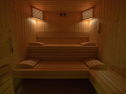 a sauna with two beds and lights in it at Borgo Fantino - Residenze e Alloggi Vacanza in Limone Piemonte