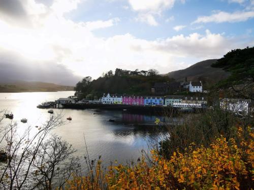 a town on a hill next to a body of water at Coolin View in Portree