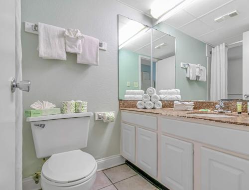 a bathroom with a toilet and a large mirror at Ocean View Double Queen Suite with Full Kitchen! Sea Mist Resort 50804 - Perfect for 2-4 guests! in Myrtle Beach