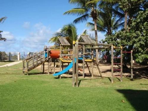a playground with a slide in a park at Beautiful beachside apartment w/ terrace, balcony. 