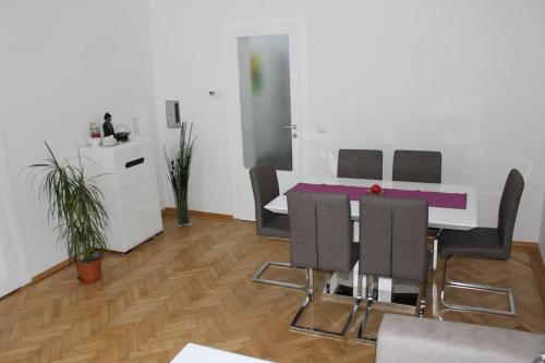 a kitchen with a table and chairs in a room at my happy place in Vienna