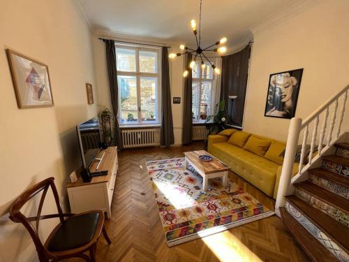 a living room with a couch and a table at The Old Stairs in Sofia