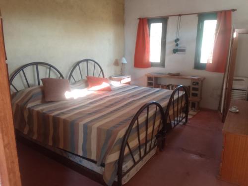 a bedroom with a large bed in a room at Chañares in San Javier