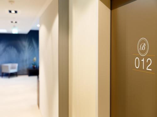 an elevator door with the number on it at Boutique Hotel Bellevue Rheinfelden / Basel in Rheinfelden
