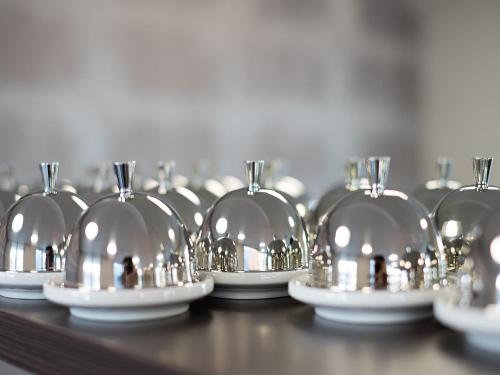 a row of glass domes on a table at Boutique Hotel Bellevue Rheinfelden / Basel in Rheinfelden