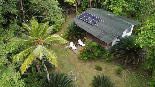 an aerial view of a house with a solar roof at Casa Galú - Capurganá in Capurganá