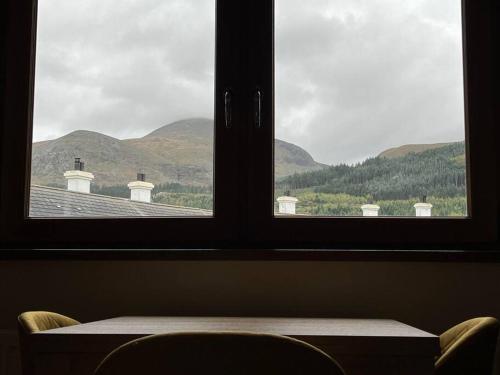 a window with a view of a roof at Lovely 2 bedroom family apartment in Newcastle in Newcastle