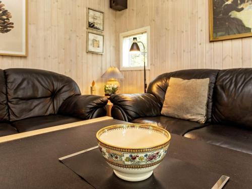 a living room with two couches and a bowl on a table at 6 person holiday home in Farsø-By Traum in Farsø