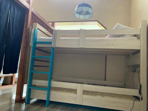 a bunk bed with a ladder and a soccer ball on it at 金閣莊 private onsen by reservation for free in Hakone
