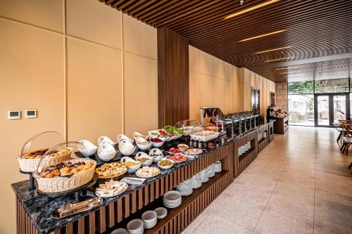 a buffet line with many different types of food at Kutaisi Inn in Kutaisi