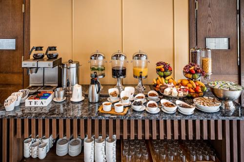 a buffet of food and drinks on a table at Kutaisi Inn in Kutaisi