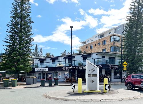a building with a car parked in front of it at Ashwood on Kings- Kings Beach in Caloundra