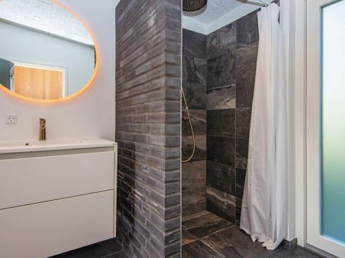 a bathroom with a shower and a sink at 8 person holiday home in Knebel-By Traum in Knebel