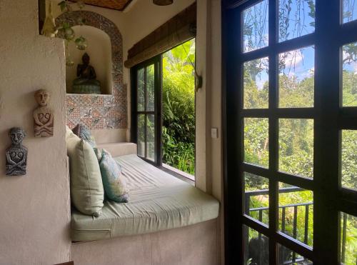 Ένα ή περισσότερα κρεβάτια σε δωμάτιο στο Villa Kalisat Resort