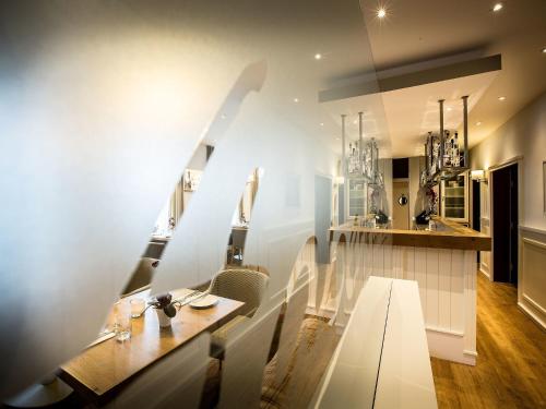 a dining room with a table and chairs at Hotel Haberkamp in Achim