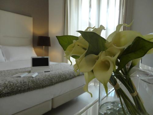 Postel nebo postele na pokoji v ubytování Soglow Business Class Hotel