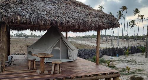a tent on a wooden deck on the beach at Kitesurf Life Glamping in Tutóia