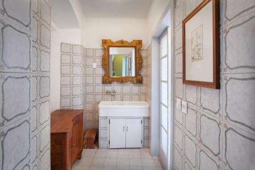 a bathroom with a sink and a mirror at Villa Oleandra with Pool up to 12 People in Volta Mantovana