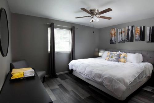 a bedroom with a bed and a ceiling fan at 604 1 Two Bedroom One Bath with King near Main Street in St. Charles