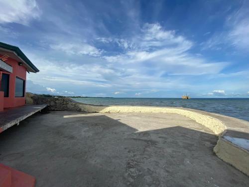 a building next to a body of water at Scott's Seaview Resort in Danao City