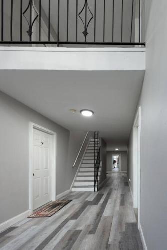 an empty hallway with a staircase in a house at 604 1 Two Bedroom One Bath with King near Main Street in St. Charles