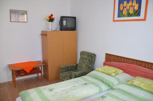 Orchidea Apartmanにあるベッド