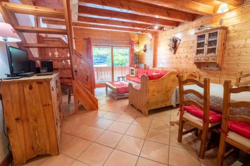 TV a/nebo společenská místnost v ubytování Jardin d'Eden 11