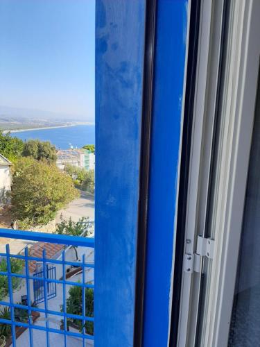 a view of the ocean from a window at Hotel Conca d'Oro in Stalettì