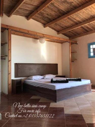 a bedroom with a large bed in a room at New Bella Sina Camp in Nuweiba