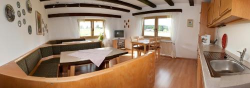 a living room with a couch and a table at Haus Anny in Haidmühle