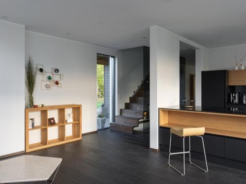 a kitchen and living room with a counter and a table at Sun Villa in Imatra