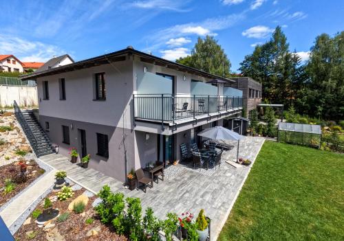 an aerial view of a house with a patio at Rezidence Sunny Hill in Frymburk