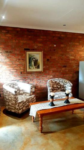 Χώρος καθιστικού στο Maretlwane Guesthouse