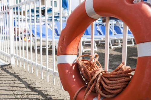 a rope is tied to a life preserver at Hotel La Baia in Diano Marina